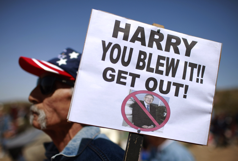 Joe Sanchez, of Las Vegas, holds a sign at the "Showdown in Searchlight" tea party rally in Searchlight, Nev., Saturday, March 27, 2010. (AP Photo/Jae C. Hong) (Jae C. Hong)