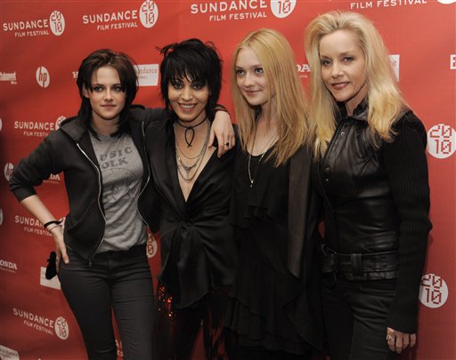 From left, Kristen Stewart, Joan Jett, Dakota Fanning and Cherie Currie pose together at the premiere of the film "The Runaways" at the Sundance Film Festival in Park City, Utah, Sunday, Jan. 24, 2010. Stewart plays Jett and Fanning plays Currie in the film, which chronicles the story of the rock band The Runaways. (AP Photo/Chris Pizzello) (AP)