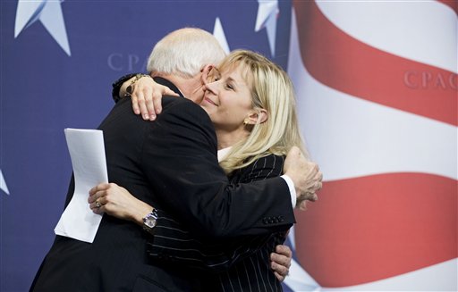 Former Vice President Dick Cheney hugs his daughter, Liz Cheney, after she surprised the Conservative Political Action Conference (CPAC) by bringing him as her guest, Thursday, Feb. 18, 2010, in Washington. (AP Photo/Cliff Owen) (AP)