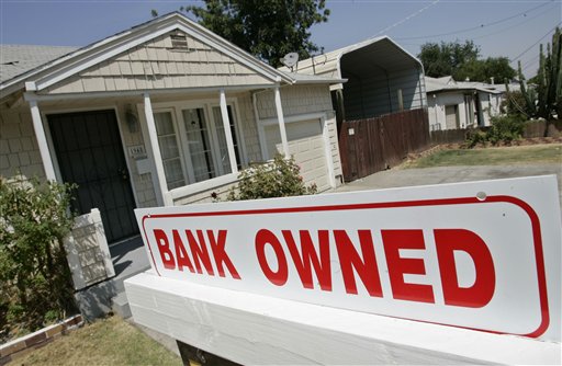 FILE - In this Aug. 14, 2008 file phtoo, a sign is posted outside a foreclosed house in Antioch, Calif. (AP Photo/Paul Sakuma, File) (AP)