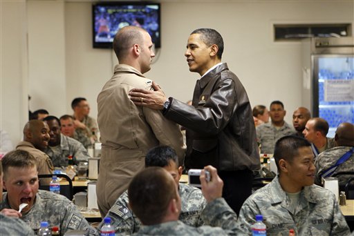 President Barack Obama greets military personnel in Dragon dining facility at Bagram Air Base in Afghanistan, Monday, March 29, 2010. (AP Photo/Charles Dharapak) (AP)