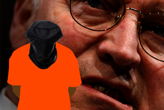 Man with a black hood over his head and his hands tied behind his back.