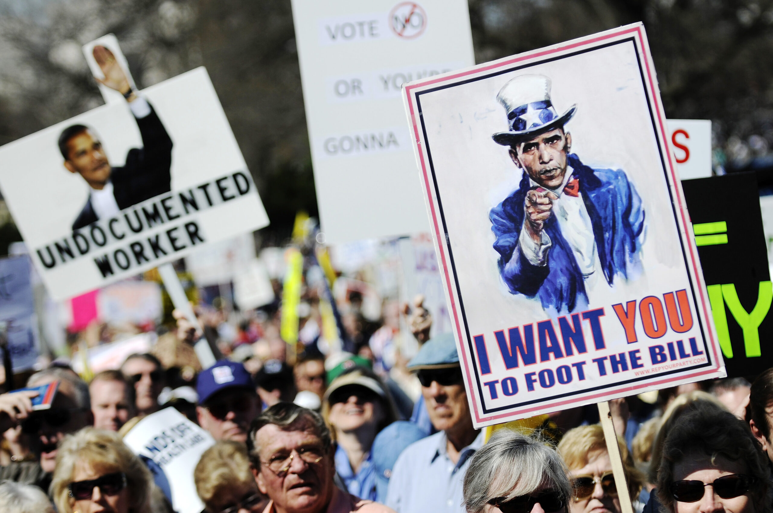 Protestors hold signs during a 'Kill the Bill' rally against President Barack Obama's health care legislation, on the west front of the U.S. Capitol in Washington, March 20, 2010. REUTERS/Jonathan Ernst    (UNITED STATES - Tags: POLITICS CIVIL UNREST HEALTH) (Reuters)