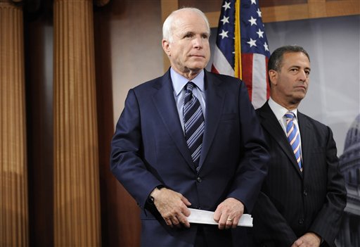 FILE - In this Jan. 7, 2009 file photo, Sen. John McCain, R-Ariz., left, and Sen. Russ Feingold, D-Wis., take part in a news conference on Capitol Hill in Washington. A federal court Friday denied a Republican Party bid to raise soft money, the unlimited donations from corporations and individuals banned by a 2002 campaign finance law. In a separate ruling, judges said a conservative group can raise unlimited sums for independent election ads but must regularly disclose its donors. (AP Photo/Susan Walsh, File) (AP)