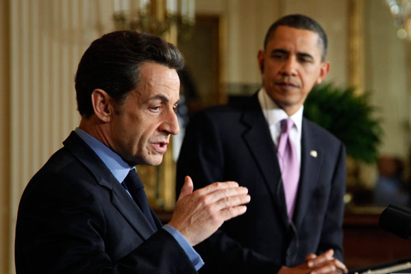 French President Nicolas Sarkozy (L) speaks during a joint news conference with U.S. President Barack Obama in the East Room of the White House in Washington, March 30, 2010.