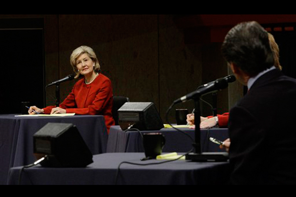 Republican candidate for Texas Governor U.S. Sen. Kay Bailey Hutchison, left, looks on as Gov. Rick Perry addresses her during the Texas GOP gubernatorial debate at the Murchison Performing Arts Center at the University of North Texas in Denton, Texas, Thursday, Jan. 14, 2010.