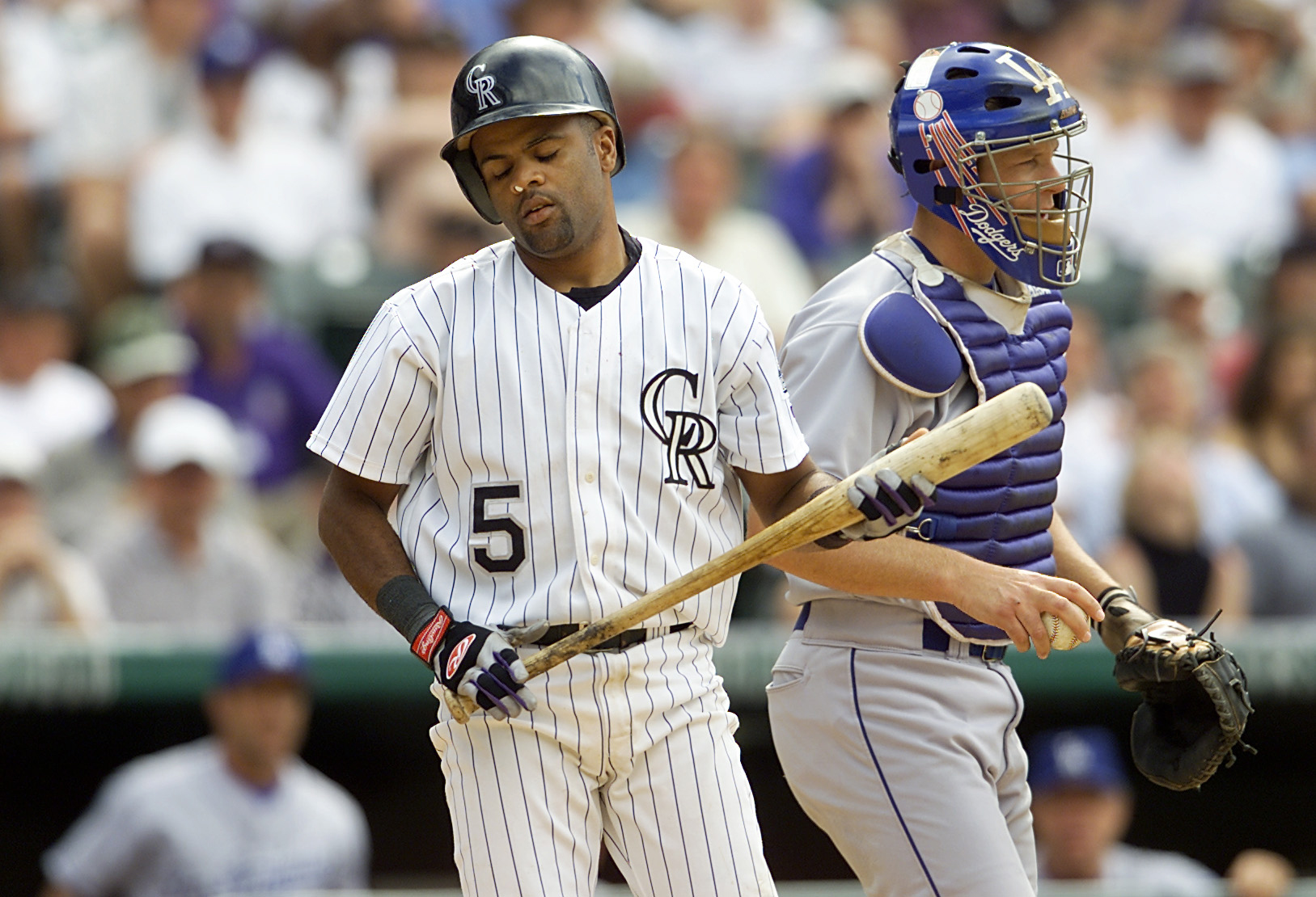 23 May 2001:  Neifi Perez #5 of the Colorado Rockies reacts after striking out, next to catcher Paul Loduca #16 on a pitch by closer Jeff Shaw of the Los Angeles Dodgers in the bottom of the ninth inning at Coors Field in Denver, Colorado. The Dodgers won 6-4.  DIGITAL IMAGE Mandatory Credit: Brian Bahr/ALLSPORT (Getty Images)