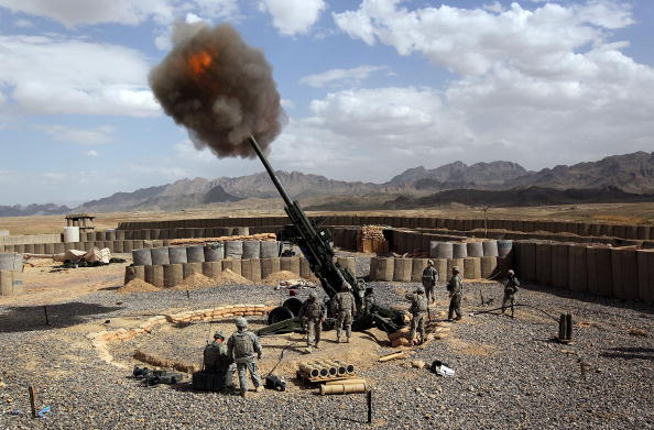 FORWARD OPERATING BASE FRONTENAC, AFGHANISTAN - MARCH 05: U.S. Army soldiers from the 3-17 Field Artillery fire a 155mm Howlitzer at a Taliban observation point on March 5, 2010 from Forward Operating Base Frontenac in Kandahar province in southern Afghanistan. The U.S. military is expected to launch a major offensive against Taliban insurgents in Kandahar in upcoming months following its recent operation in Marja, in neighboring Helmand province.  (Photo by John Moore/Getty Images) (John Moore)