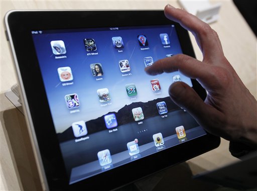 FILE - In the file photo made Jan. 27, 2010, the iPad is shown after it was unveiled at the Moscone Center in San Francisco. Apple Inc.'s iPad tablet computer hits U.S. shelves on Saturday, April 3, 2010, but fans who want the new touch-screen gadget shipped directly to them must wait a week.(AP Photo/Marcio Jose Sanchez, file) (AP)