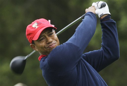 FILE - This Oct. 11, 2009, file photo shows Tiger Woods teeing off at the Presidents Cup at Harding Park Golf Course in San Francisco.  Woods is back at home after a week of family counseling in Arizona and is trying to get back into a routine that includes golf and fitness, according to a person with knowledge of his schedule. (AP Photo/Jeff Chiu, File) (AP)
