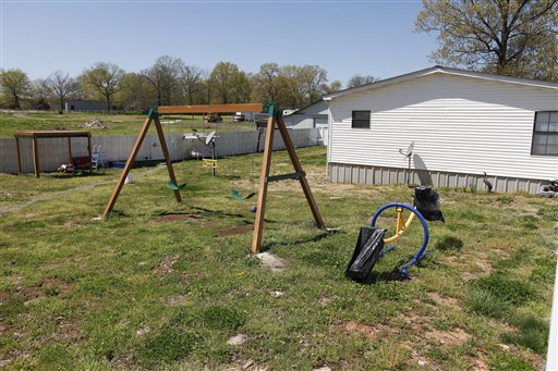 A swing set is seen in the backyard of Torry Hansen and Nancy Hansen's shared backyard in Shelbyville, Tenn. on Friday, April 9, 2010. Russia has threatened to suspend all child adoptions by U.S. families after a 7-year-old boy adopted by a woman from Tennessee was sent alone on a one-way flight back to Moscow with a note saying he was violent and had severe psychological problems. Artyom Savelyev was put on a plane by his adopted grandmother, Nancy Hansen. (AP Photo/Josh Anderson) (AP)