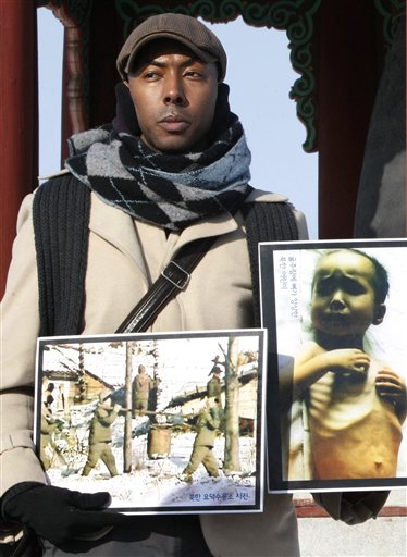 FILE - In this file photo taken on Jan. 12, 2010, American Aijalon Mahli Gomes, whose identification was made by Seoul-based activist Jo Sung-rae, participates in a rally organized by Jo denouncing North Korean's human rights conditions at the Imjingak Pavilion, near the demilitarized zone (DMZ) of Panmunjom that separates the two Koreas since the Korean War, in Paju, South Korea. North Korea said Wednesday, April 7, 2010, it has convicted and sentenced an American man to eight years in a labor prison and a fine equivalent to $700,000 for entering the country illegally and unspecified hostile acts.  (AP Photo/Ahn Young-joon, File) (AP)