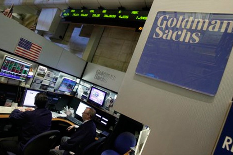 Traders work in the Goldman Sachs booth on the floor of the New York Stock Exchange on  April 19.