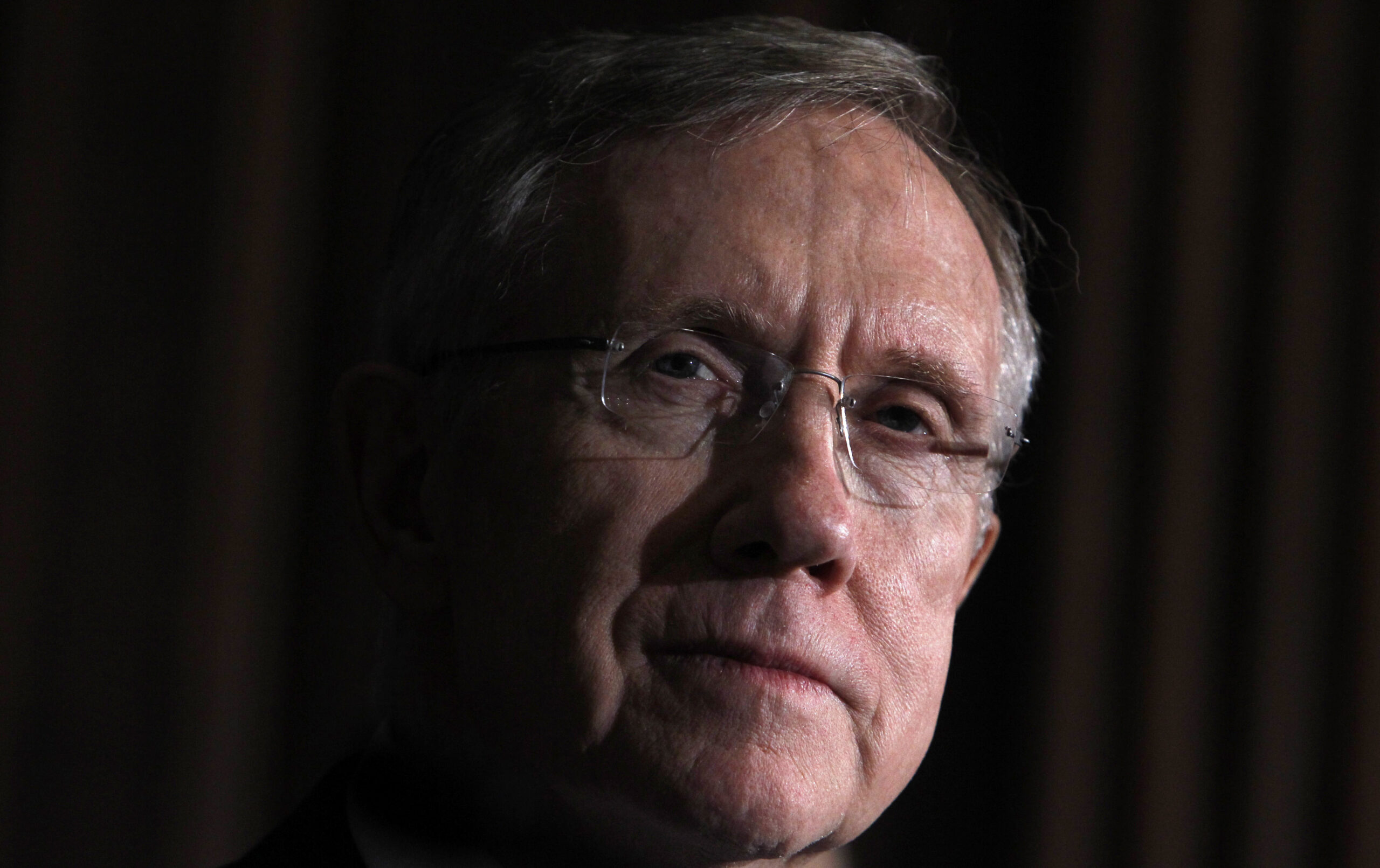 U.S. Senate Majority leader Harry Reid (D-NV) listens to remarks after the Senate approved a package of changes to President Barack Obama's landmark healthcare overhaul and sent the bill to the House of Representatives for final passage in Washington, March 25, 2010.   REUTERS/Jim Young   (UNITED STATES - Tags: POLITICS HEALTH) (Reuters)