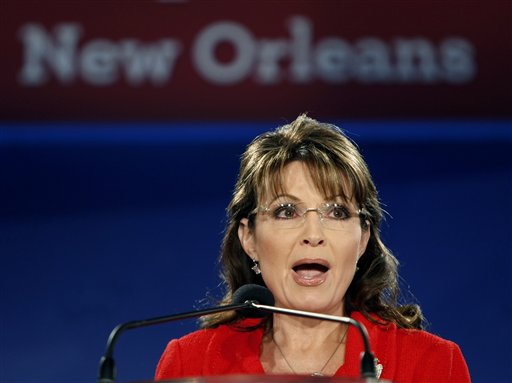 Sarah Palin speaks at the Southern  Republican Leadership Conference in New Orleans, Friday, April 9, 2010. Former vice presidential candidate Sarah Palin says her "Don't retreat _ reload" slogan is a call for political activism, not violence.  (AP Photo/Gerald Herbert) (AP)