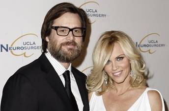 FILE - In this Oct. 1, 2009 file photo, Jim Carrey, left, and Jenny McCarthy arrive at the UCLA Department of Neurosurgery 2009 Visionary Ball in Beverly Hills, Calif.  (AP Photo/Matt Sayles, file) (AP)
