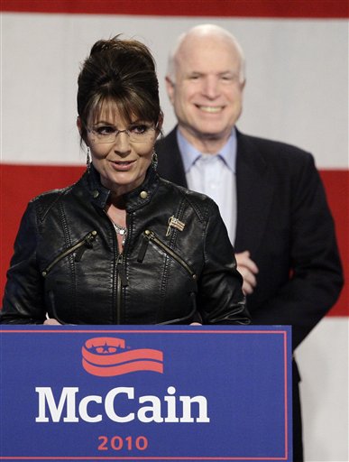 FILE - In this Friday, March 26, 2010  file photo, Sarah Palin, left, talks at a campaign rally for Sen. John McCain, back, at the Pima County Fairgrounds in Tucson, Ariz. Sarah Palin and thousands of tea party activists plan to descend on Sen. Harry Reid's hometown in the Nevada desert Saturday to call for the ouster of Democrats who supported the health care overhaul. (AP Photo/Ross D. Franklin, File) (AP)