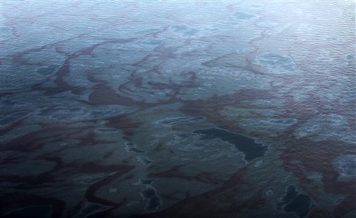 In this aerial photo taken in the Gulf of Mexico off Louisiana's tip, oil is seen near the site last week's collapse and spill of the Deepwater Horizon oil rig Wednesday, April 28, 2010. (AP Photo/Gerald Herbert) (AP)