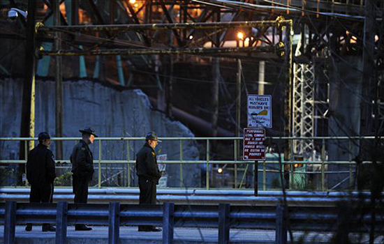 State Police monitor the entrance to the Massey Energy's Upper Big Branch mine where rescue and recovery efforts have been delayed again following Monday's explosion in Montcoal, W.Va., Friday, April 9, 2010. Twenty five miners are known to be dead and four remain missing from the explosion. (AP Photo/Bob Bird) (Bob Bird)