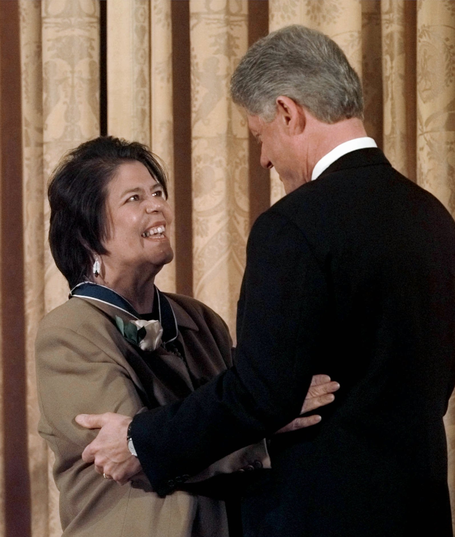 FILE - In this Jan. 15, 1998 file photo, President Bill Clinton hugs former Cherokee Nation chief Wilma Mankiller after presenting her with a Presidential Medal of Freedom during a ceremony at the White House. Mankiller, one of the few women ever to lead a major American Indian tribe, died Tuesday April 6, 2010 after battling pancreatic cancer. She was 64. (AP Photo/Dennis Cook, File) (Associated Press)