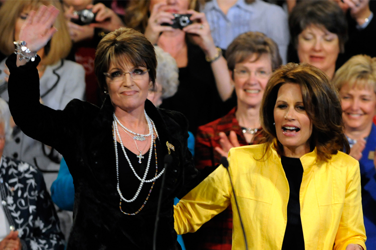 Sarah Palin waves to the crowd after a campaign appearance in Minneapolis for Rep. Michele Bachmann, R-Minn., on Wednesday. (AP Photo/Jim Mone)