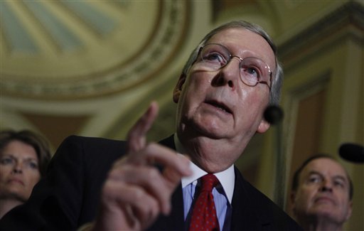 Senate Minority Leader Mitch McConnell of Ky., center, accompanied by Sen. Lisa Murkowski, R-Alaska, left, and the Senate Banking Committee's Ranking Republican Sen. Richard Shelby, R-Ala., speaks to reporters on Capitol Hill in Washington, Tuesday, April, 13, 2010.  (AP Photo/Manuel Balce Ceneta) (AP)