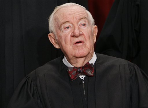 FILE - In this Sept. 29, 2009, file photo Associate Justice John Paul Stevens sits for a new group photograph at the Supreme Court in Washington. Stevens, the oldest justice who turns 90 this April 2010, says he'll decide soon about retiring, for his own peace of mind and to give President Barack Obama and the Senate plenty of time to replace him. (AP Photo/Charles Dharapak, File) (AP)
