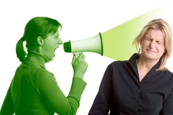 Young woman shouting at another woman through a megaphone (Mateusz Zagorski)