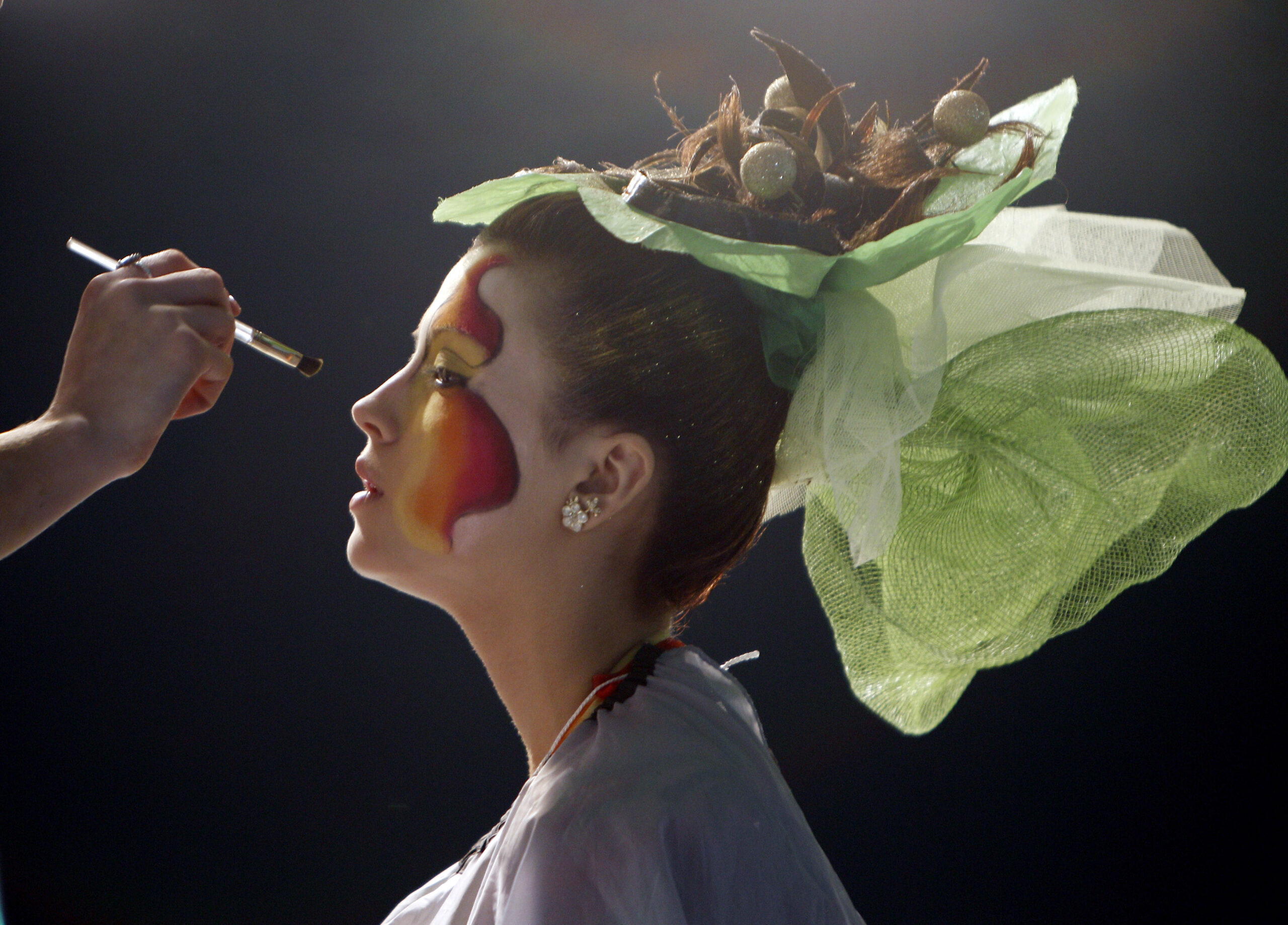 A stylist puts make-up on a model during the Crystal Angel Festival in Kiev April 14, 2010. The annual international competition of hairdressers, fashion and design started in the Ukrainian capital today. REUTERS/Gleb Garanich (UKRAINE - Tags: FASHION SOCIETY) (Reuters)