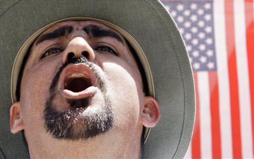 A protester shouts as he joins thousands attending an immigration rally in Arizona on April, 25, 2010. (AP Photo/Ross D. Franklin)