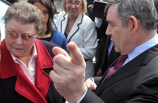 Britain's Prime Minister Gordon Brown, wearing a Sky News microphone, speaks to local resident Gillian Duffy, 65, while campaigning for Britain's May 6 General Election in Rochdale, England, Wednesday April 28, 2010. Brown was caught on microphone describing a voter he had just spoken to - apparently Duffy - as a "bigoted woman". The comments were made as he got into his car, not realising that he had the microphone pinned to his jacket. He told an aide: "That was a disaster - they should never have put me with that woman. Whose idea was that? It's just ridiculous..." Asked what she had said, he replied: "Everything, she was just a bigoted woman."(AP Photo< Lewis Whyld-pa) **UNITED KINGDOM OUT: NO SALES: NO ARCHIVE:** (AP)