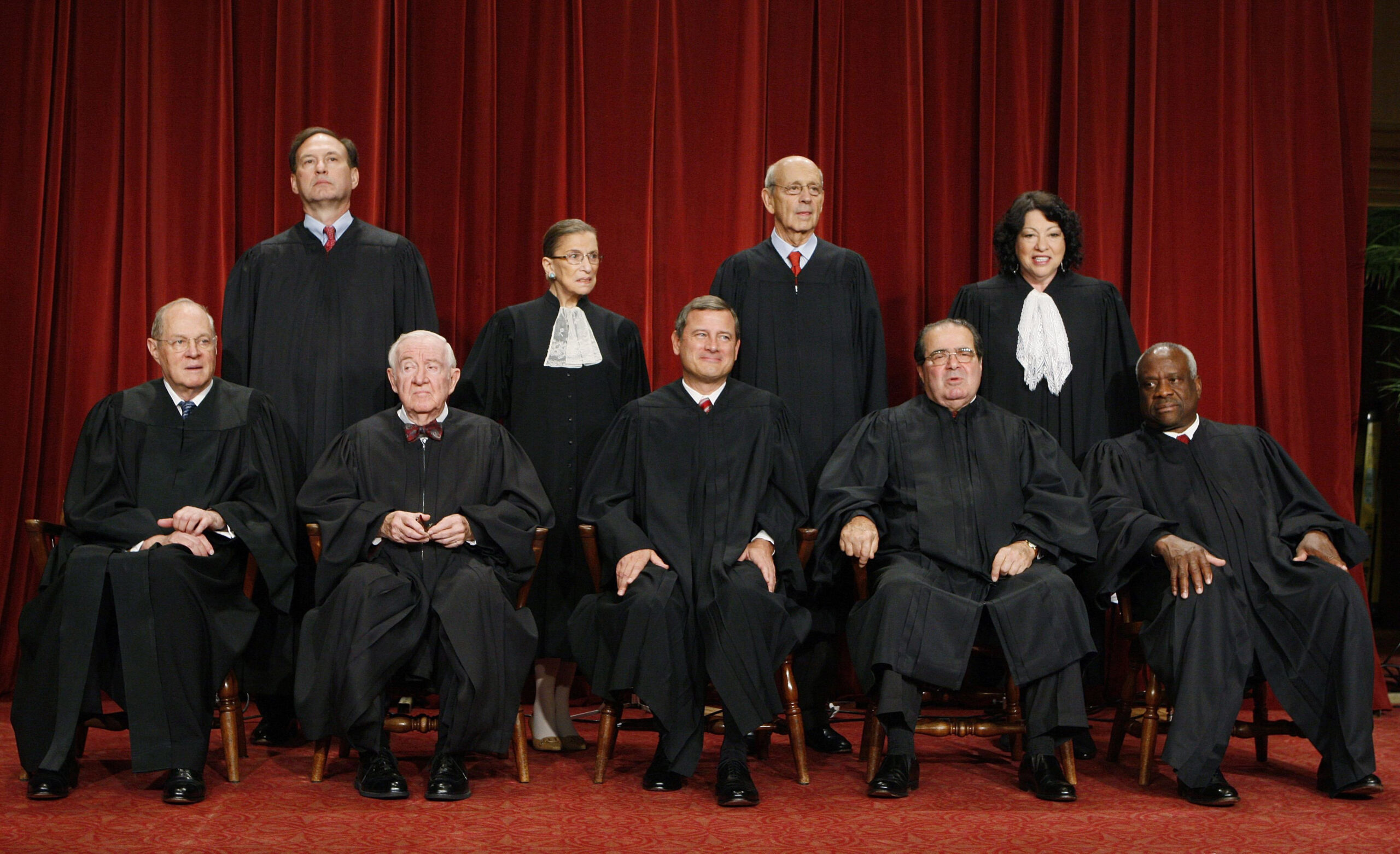 In this Sept. 29, 2009 file photo, the Supreme Court poses for a portrait at the Supreme Court in Washington. Seated, from left are: Associate Justice Anthony M. Kennedy, Associate Justice John Paul Stevens, Chief Justice John G. Roberts, Associate Justice Antonin Scalia, and Associate Justice Clarence Thomas. Standing, from left are: Associate Justice Samuel Alito Jr., Associate Justice Ruth Bader Ginsburg, Associate Justice Stephen Breyer, and Associate Justice Sonia Sotomayor. (AP Photo/Charles Dharapak. FILE )