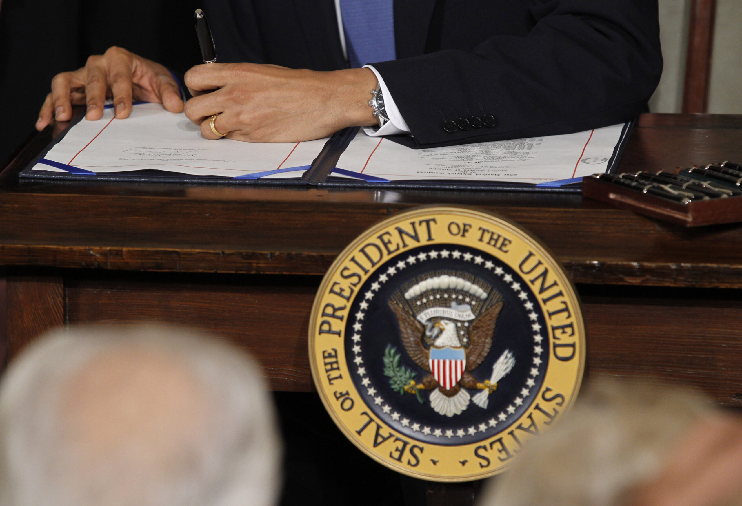 U.S. President Barack Obama signs the healthcare legislation during a ceremony in the East Room of the White House in Washington, March 23, 2010.   REUTERS/Jason Reed   (UNITED STATES - Tags: POLITICS HEALTH) (Reuters)
