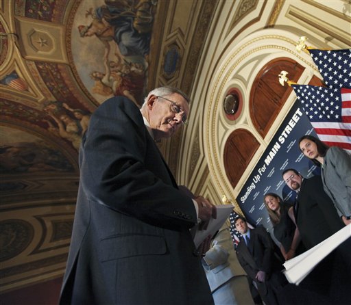 Senate Majority Leader Harry Reid of Nev., looks at signed petition papers on a table in support of a strong financial reform, during a news conference discussing Wall Street accountability legislation, Wednesday, May 5, 2010, on Capitol Hill in Washington.   (AP Photo/Manuel Balce Ceneta) (AP)