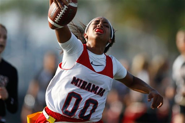 Miramar quarterback Chelsey Walsh stretches for yardage during the quarterfinals of the state high school flag football championships against Douglas in Boca Raton, Fla., Friday, May 7, 2010.