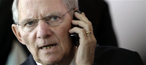 German Finance Minister Wolfgang Schaeuble makes a telephone call prior to a meeting of the cabinet at the chancellery in Berlin, Germany, Wednesday, May 19, 2010. German Chancellor Angela Merkel called Wednesday for tougher financial regulation and a crackdown on government debt, saying the future of the euro currency and a united Europe itself were at stake. Merkel urged lawmakers to pass Germany's share of a new 750 billion euro  (US dlrs 1 trillion) eurozone rescue package, saying that defending the shared European currency is "about no more and no less than the preservation of the European idea."  (AP Photo/Michael Sohn) (AP)