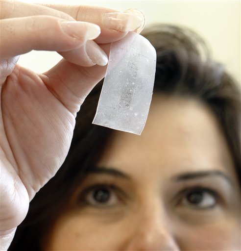 In this photo taken Friday, May 14, 2010, at the MaGee Womens Research Institute in  Pittsburgh, lead researcher Lisa Rohan shows a vaginal film formulated with drugs to target against HIV infection.  (AP Photo/Keith Srakocic) (AP)