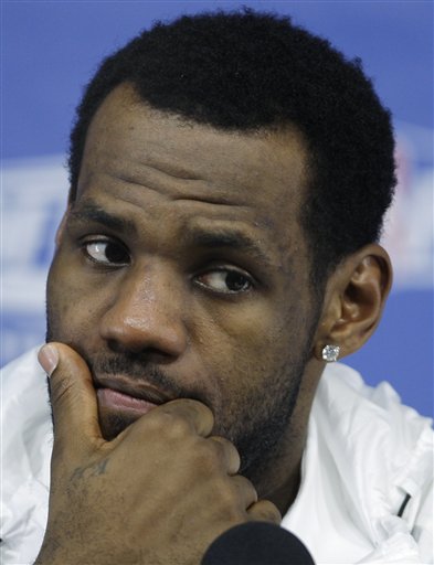 Cleveland Cavaliers forward LeBron James listens to a question during a news conference after losing 94-85 to the Boston Celtics in Game 6 of an NBA basketball second-round playoff series, Thursday, May 13, 2010, in Boston.  With no title again for Cleveland this year, James will have to decide if it's time to go look for it elsewhere.(AP Photo/Charles Krupa) (AP)