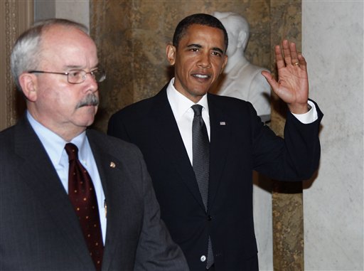 President Barack Obama, escorted by Senate Sergeant-at-Arms Terrance Gainer, waves as he arrives on Capitol Hill in Washington, Tuesday, May 25, 2010, to meet with Senate Republicans behind closed doors for talks ranging from jobs to the massive Gulf oil spill and prospects for strengthening border security this election year. (AP Photo/Carolyn Kaster) (AP)