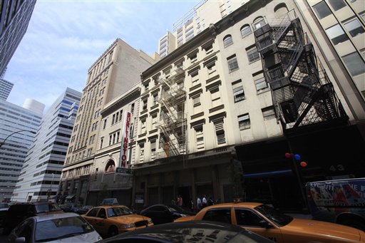 FILE - In this file photo of Thursday, May 6, 2010, traffic passes a building in lower Manhattan that once housed a Burlington Coat Factory store, in New York.  A 13-story mosque and Islamic cultural center is planned to replace the building that was damaged by airplane debris on Sept. 11, 2001. Now officials say the mosque will need the approval of the city's Landmarks Preservation Commission. A decades-old proposal to designate the building that would be torn down to make room for the planned mosque as historic must be put to a vote, an official says. Separately, a community board vote is planned Tuesday, May 25, 2010, on whether to support the plan for a mosque and Islamic cultural center.  (AP Photo/Mark Lennihan, File) (AP)