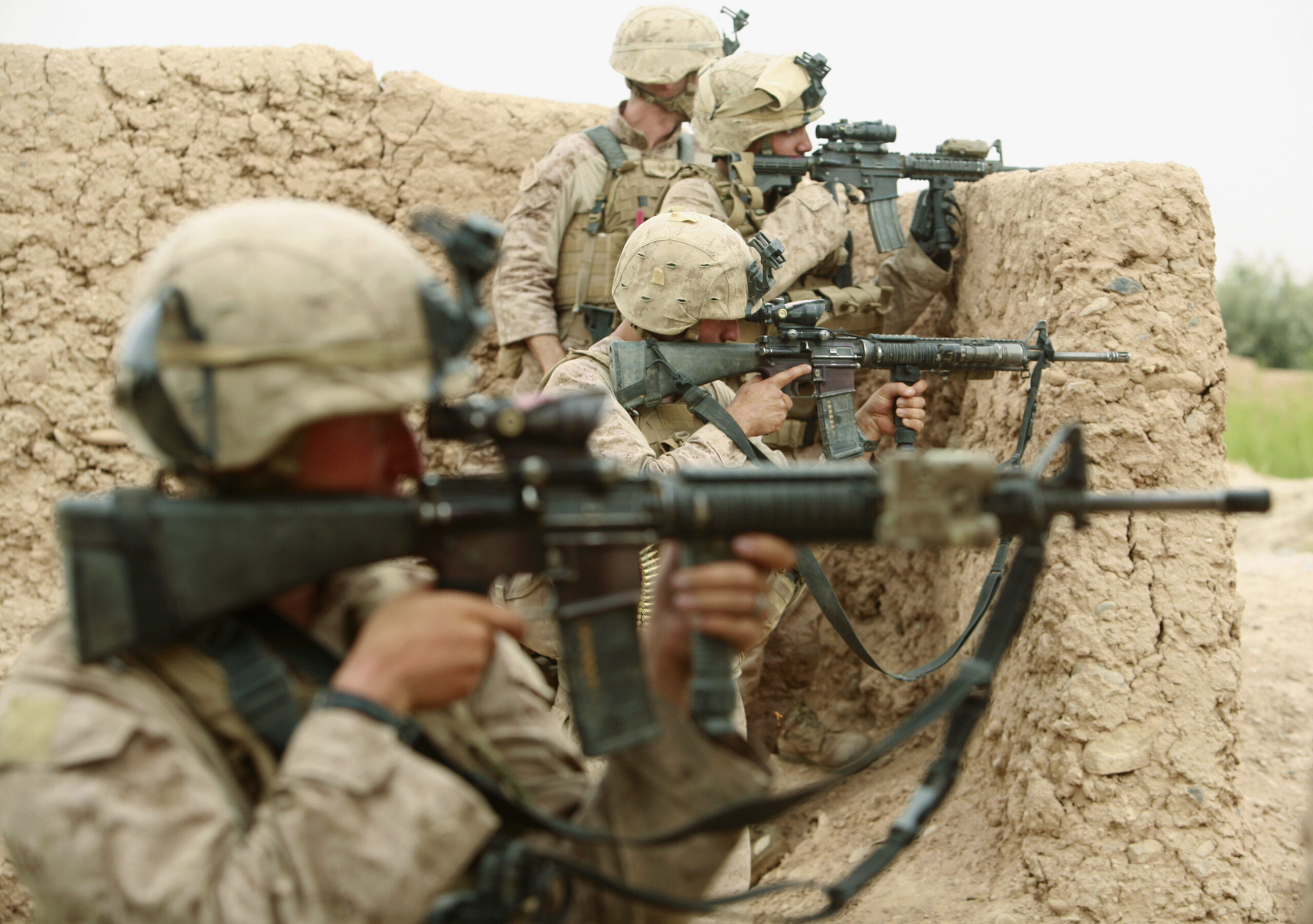 U.S. Marines from Lima Company 3rd Battalion, 6th Marines aim their weapons during a shootout with Taliban fighters in Karez-e-Sayyidi, in the outskirts of Marjah district, Helmand province, May 15, 2010. REUTERS/Asmaa Waguih (AFGHANISTAN - Tags: MILITARY CONFLICT) (Reuters)