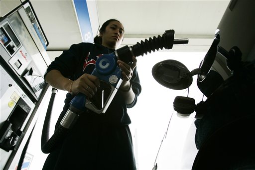 FILE - In this June 9, 2009 file photo, a Chevron customer pumps gas at a dealership in South San Francisco, Calif. Many analysts who predicted that retail gasoline prices would top $3 per gallon for a short time this summer, 2010, now are looking for prices to move lower or at least stabilize heading into the summer driver season. (AP Photo/Paul Sakuma, file) (AP)
