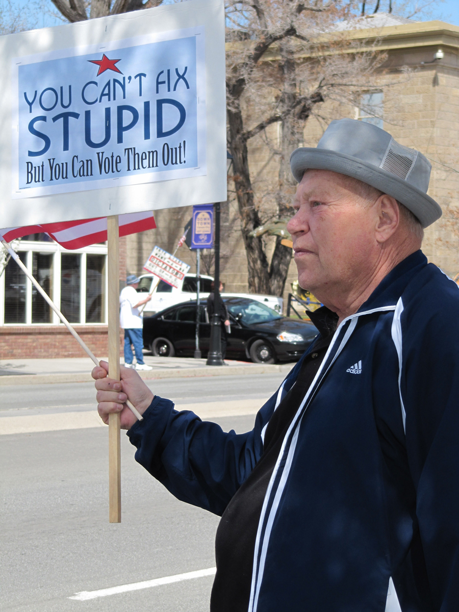 Warren Jensen holds a sign along  U.S. 395 during a tea party rally and tax protest on the Capitol grounds in Carson City, Nev., Thursday, April 15, 2010. The 73-year-old Jensen says he's new to political activism, but became involved because he's angry over government.  (AP Photo/Sandra Chereb) (Sandra Chereb)