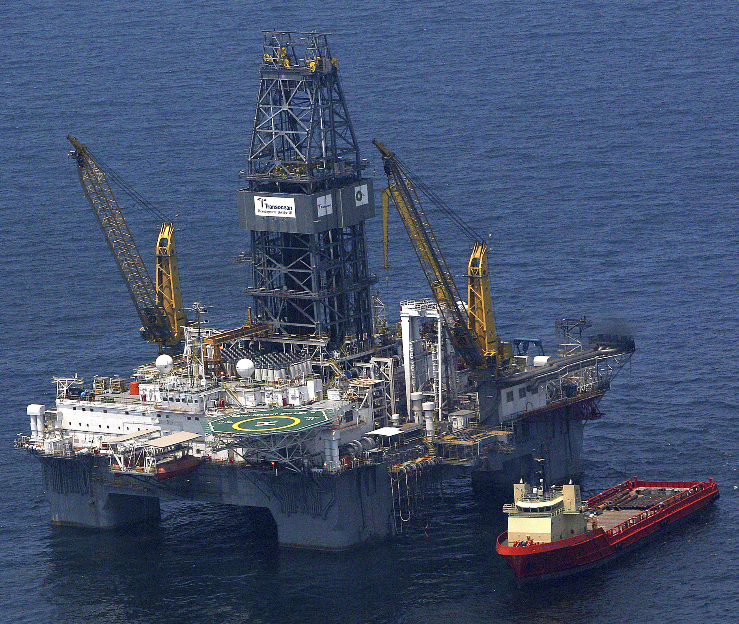A relief platform and oil recovery ship sits over the Deepwater Horizon wellhead in the Gulf of Mexico 55 miles (89 km) south of Port Fourchon, Louisiana May 8, 2010. BP Plc engineers positioned a four-story metal chamber above a gushing, ruptured oil well on the seabed of the Gulf of Mexico on Saturday in an unprecedented effort to contain a possibly catastrophic spill.   REUTERS/Sean Gardner (UNITED STATES - Tags: DISASTER ENVIRONMENT) (Reuters)