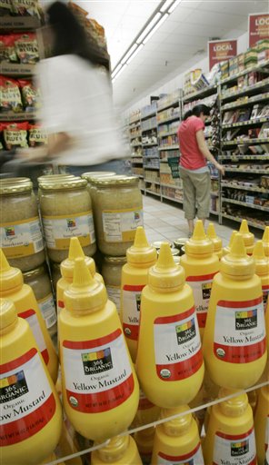 In this photo taken Tuesday, May 11, 2010, shoppers browse near a display of 365 Organic brand mustard at a Whole Foods Market, Inc., store in Little Rock, Ark. Whole Foods reports quarterly earnings, Wednesday, May 12, 2010, after the market close. 365 Organic is a Whole Foods brand. (AP Photo/Danny Johnston) (AP)