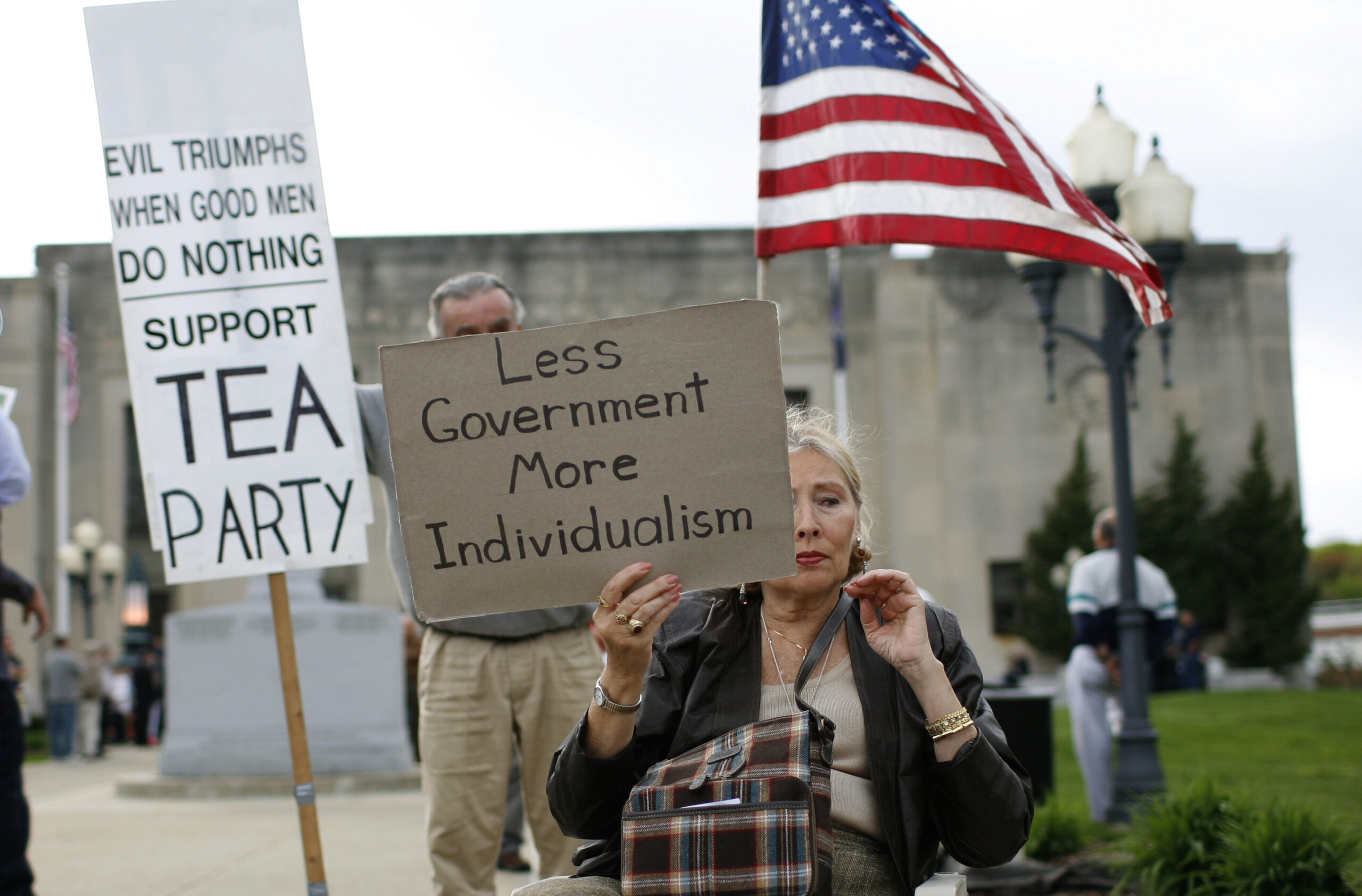 A woman holds a sign at a tax day rally by Tea Party activists in the New York City suburb of New City, New York, April 15, 2010. April 15 is the deadline for filing tax returns in the U.S.  REUTERS/Mike Segar  (UNITED STATES - Tags: BUSINESS POLITICS) (Reuters)