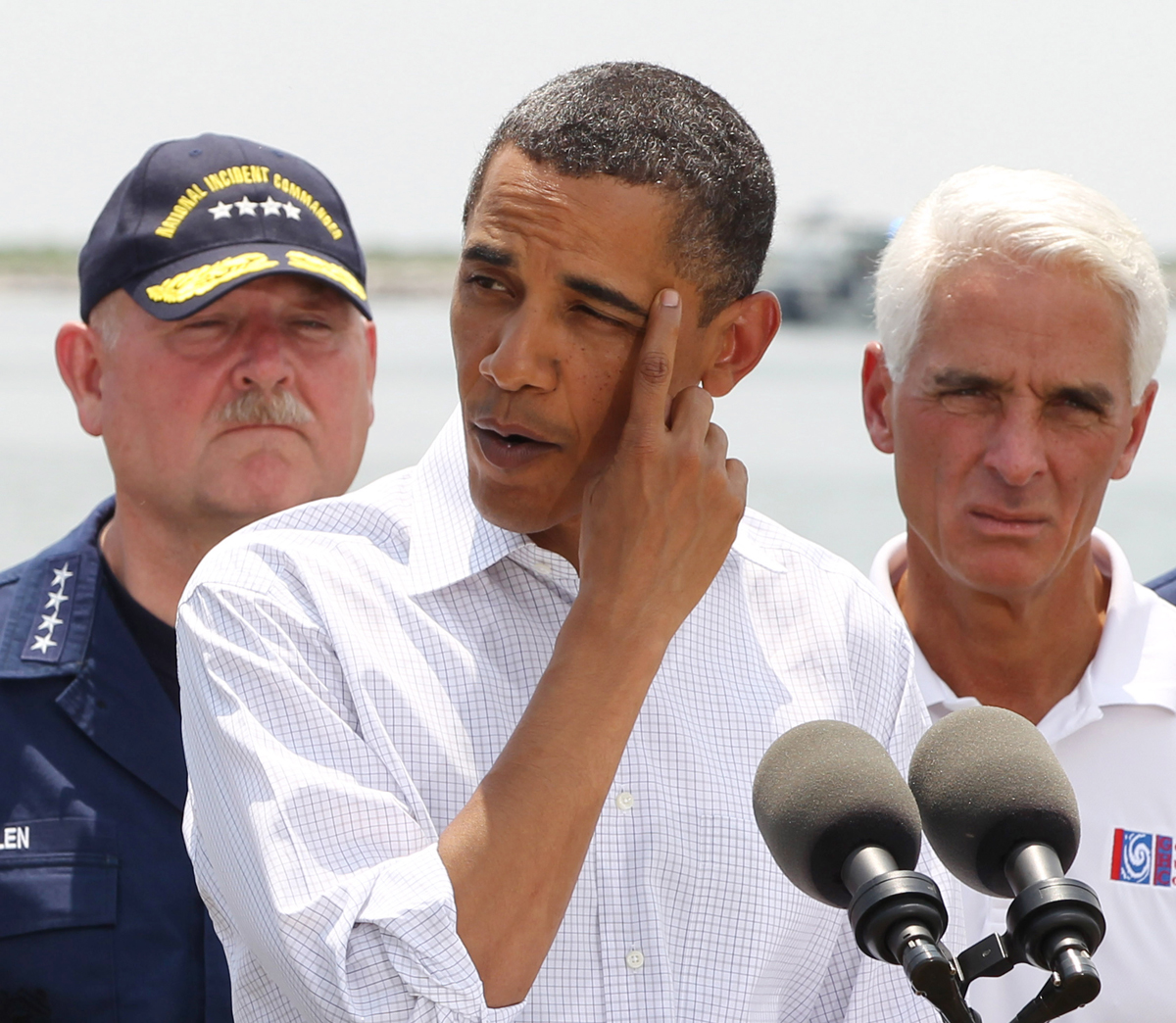 U.S. President Barack Obama speaks after a briefing on the damage along the Louisiana coastline caused after a BP oil line ruptured in the Gulf of Mexico, May 28, 2010. (From L-R) National Incident Commander U.S. Coast Guard Adm. Thad Allen , Obama, and Florida Gov. Charlie Crist.  REUTERS/Larry Downing  (UNITED STATES - Tags: POLITICS) (Â© Larry Downing / Reuters)
