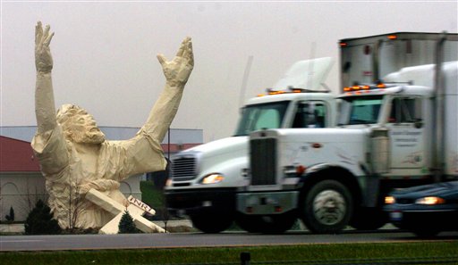 FILE -- A Nov. 17, 2004 file photo shows traffic on I-75 just north of the Monroe, Ohio, going by  a six story high statue of Jesus  under construction at the Solid Rock Church  Nov. 17, 2004.  The 62-foot-tall statue made of plastic foam and fiberglass over a steel frame was stuck by lightning and destroyed Monday June 14, 2010. (AP Photo/The Enquirer, Glenn Hartong/file)  -- Mandatory Credit -- (AP)