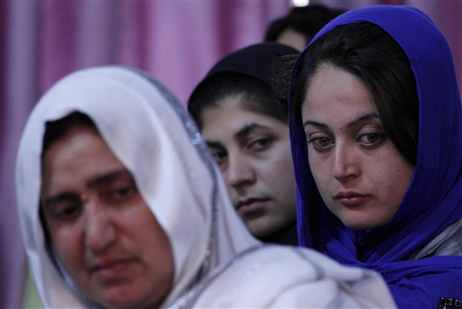 Afghan women, victims of war, look on during a "victims' jirga"  (a meeting) in Kabul. Afghanistan, Sunday, May 9, 2010. Mothers of slain teenage sons, men marred by mine blasts and tearful widows were among Afghans who spoke out Sunday at a conference billed as the first major gathering of victims of decades of war in their country. (AP Photo/Dar Yasin) (AP)