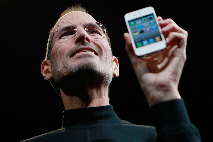 Apple CEO Steve Jobs holds the new iPhone 4 at the Apple Worldwide Developers Conference in San Francisco on Monday.